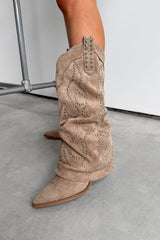 Beige suede Western cowboy boots worn by a person on a light gray floor. ETTA Studded Slouched Cowboy Western Boots - Beige Suede - 4