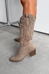 Beige knee-high boot with detailed design on a gray floor. KANSAS Knee High Western Cowboy Boots - Taupe.